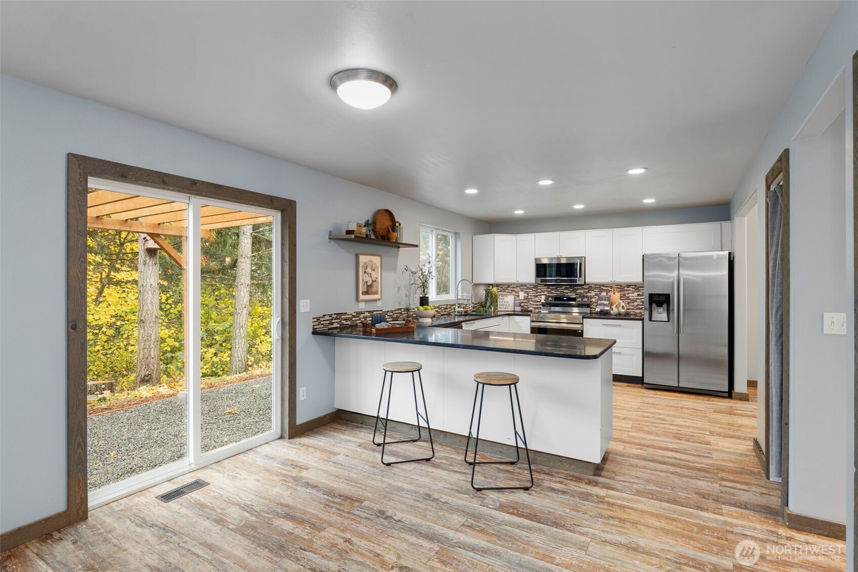 7506 353rd Street South Roy, WA 98580 - Photo 14 of 38 a kitchen with stainless steel appliances granite countertop a refrigerator and a sink