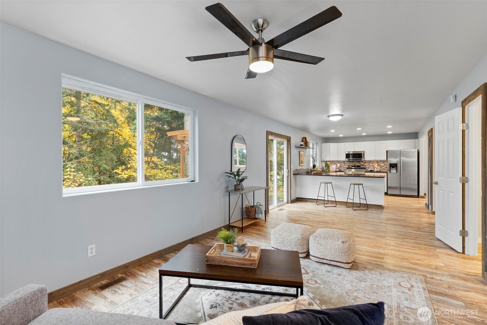 7506 353rd Street South Roy, WA 98580 - Photo 19 of 38 a living room with furniture and a large window