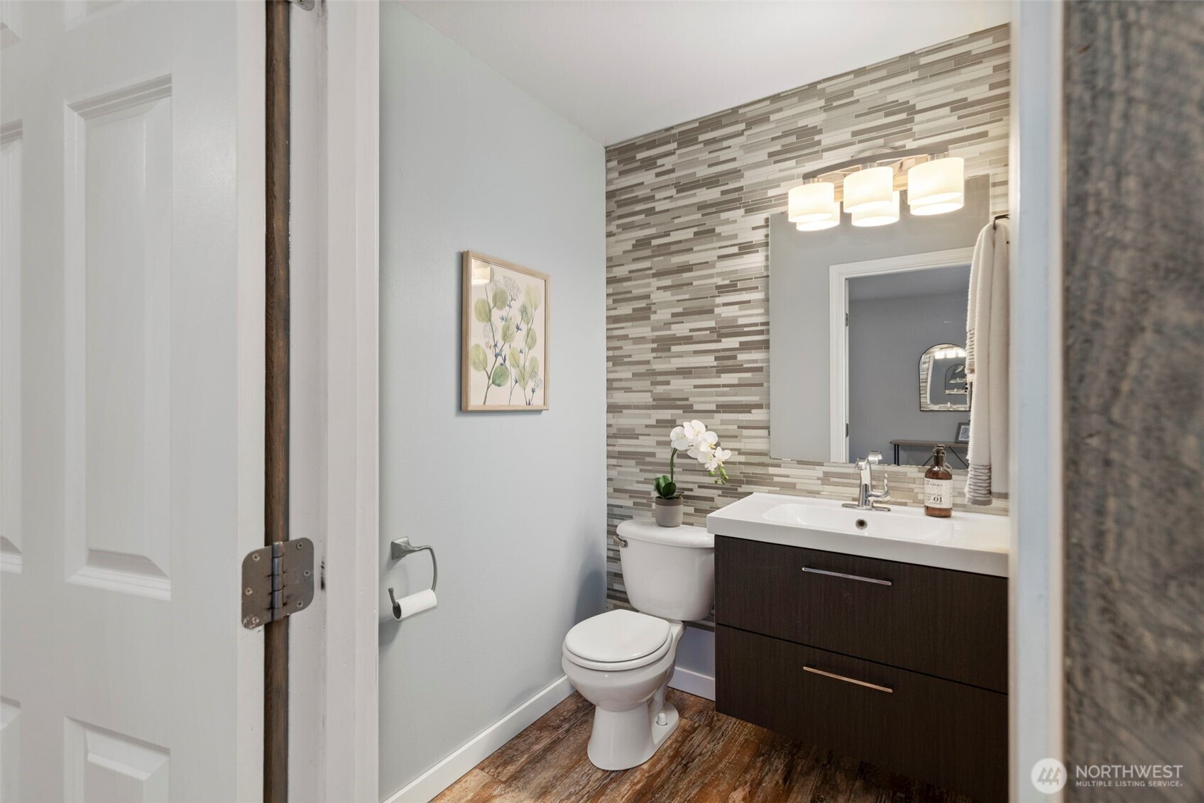 7506 353rd Street South Roy, WA 98580 - Photo 20 of 38 a bathroom with a sink vanity mirror and toilet