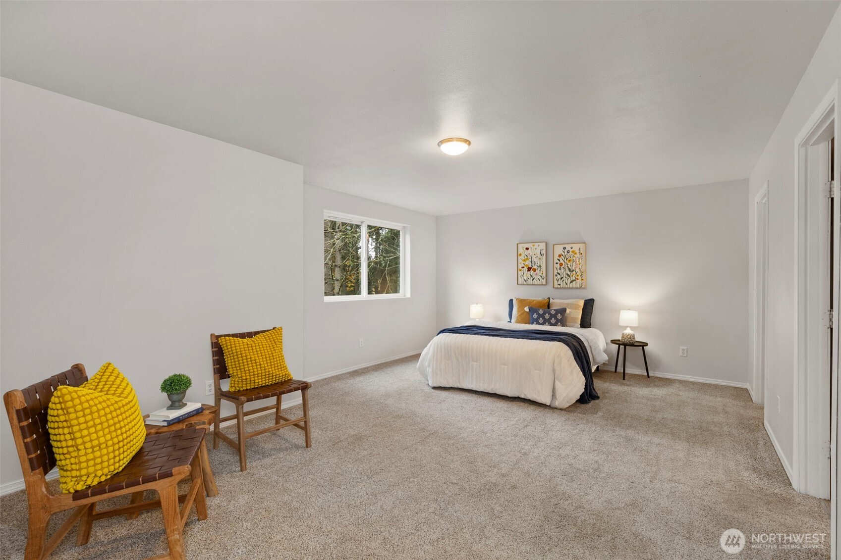 7506 353rd Street South Roy, WA 98580 - Photo 22 of 38 a bedroom with a bed and chair