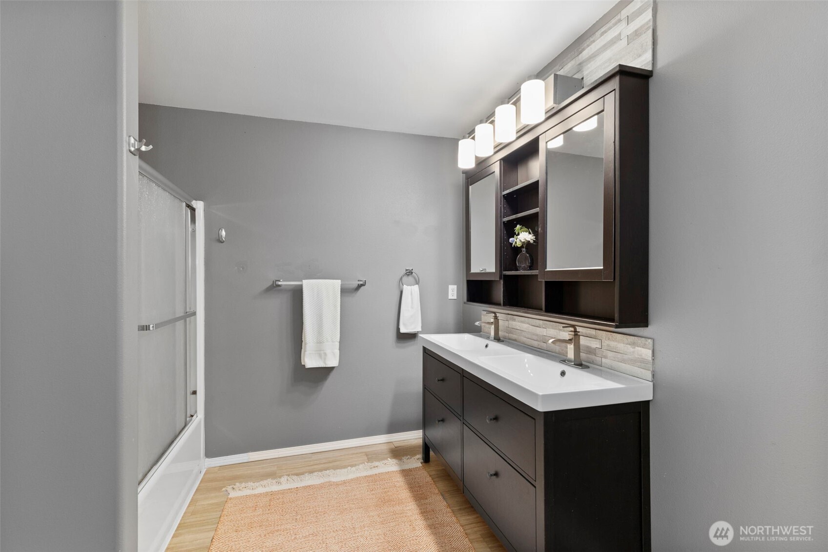 7506 353rd Street South Roy, WA 98580 - Photo 25 of 38 a bathroom with a sink and a mirror