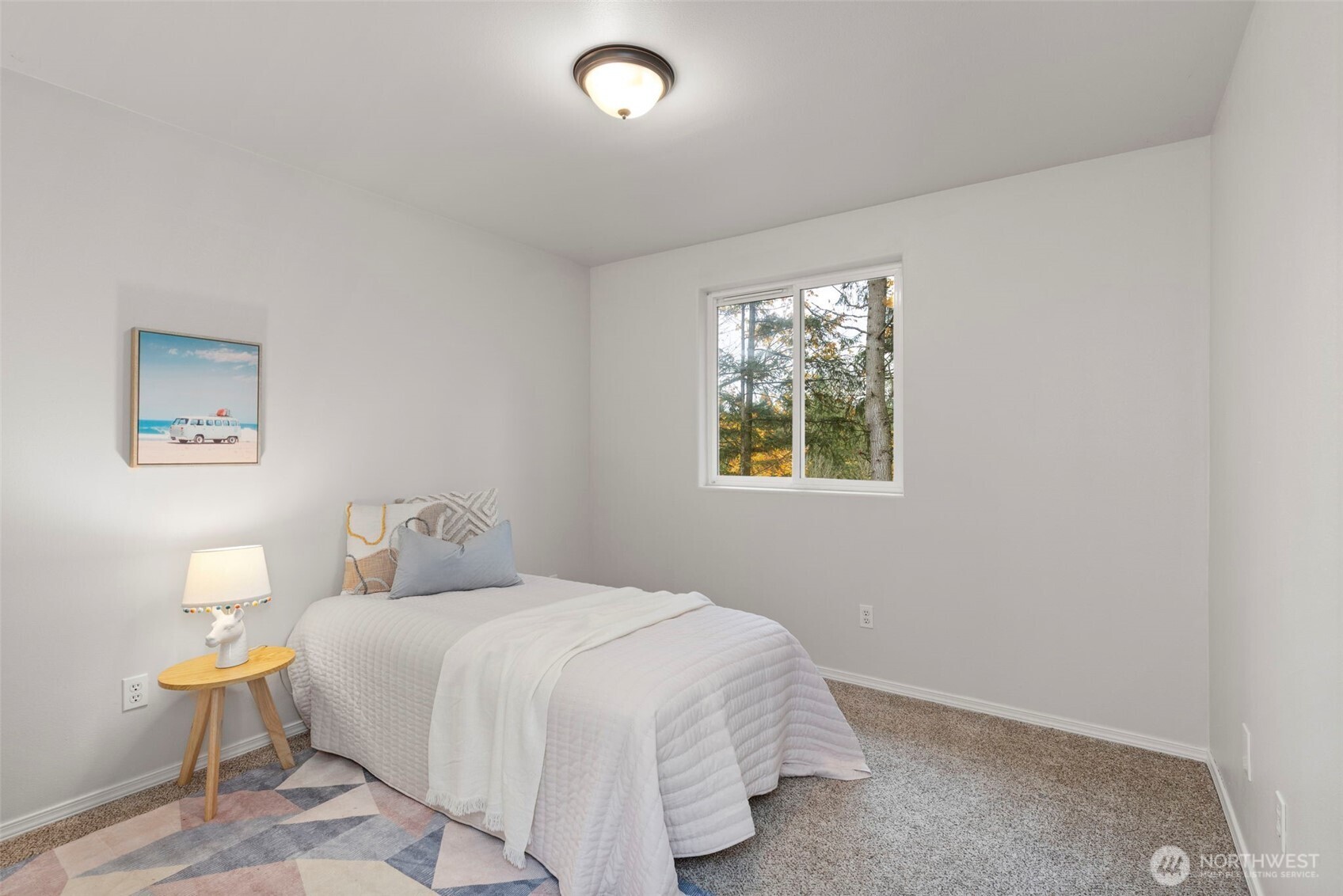 7506 353rd Street South Roy, WA 98580 - Photo 27 of 38 a bedroom with a bed and a window