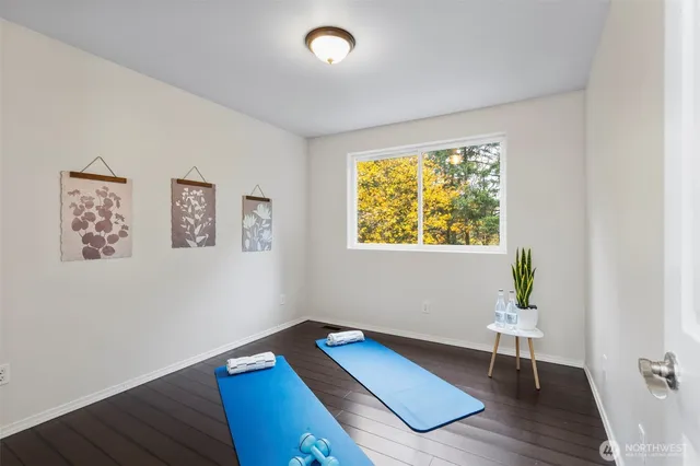 a bathroom with a double vanity sink mirror and toilet