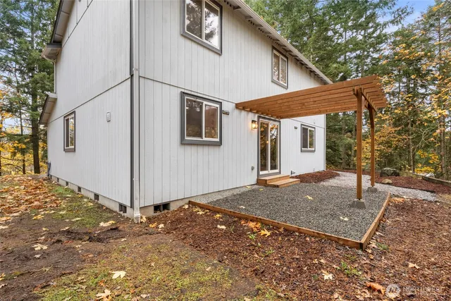 a view of a backyard with large trees