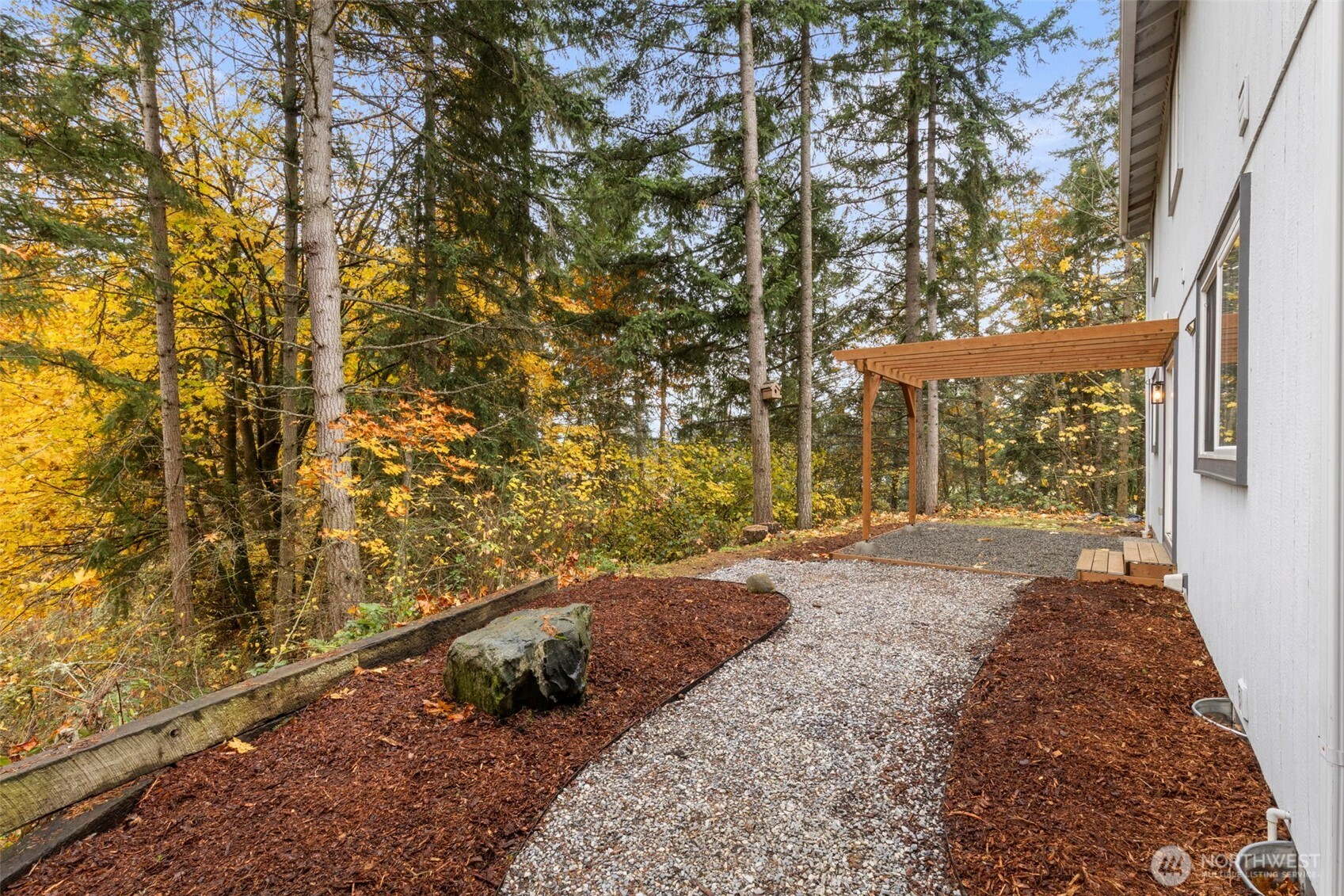 7506 353rd Street South Roy, WA 98580 - Photo 33 of 38 a view of a backyard with large trees