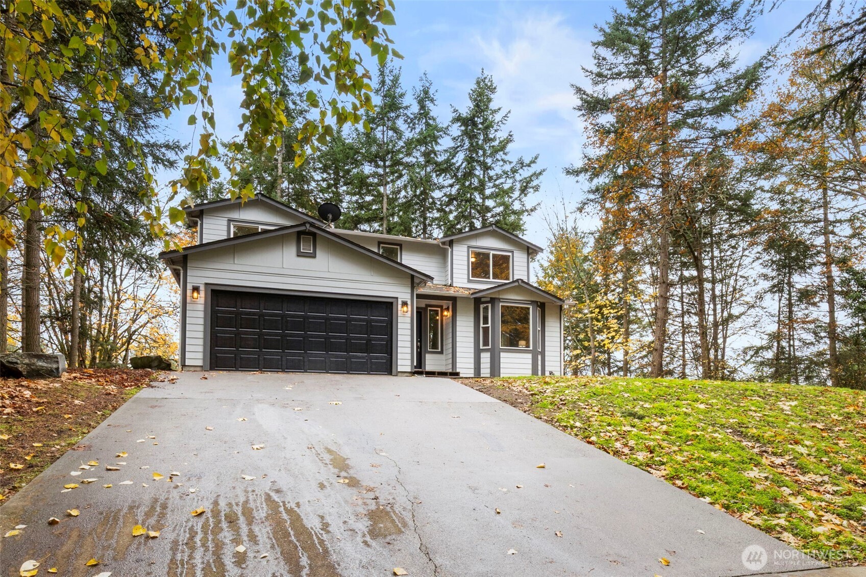 7506 353rd Street South Roy, WA 98580 - Photo 6 of 38 a front view of a house with a yard covered with snow