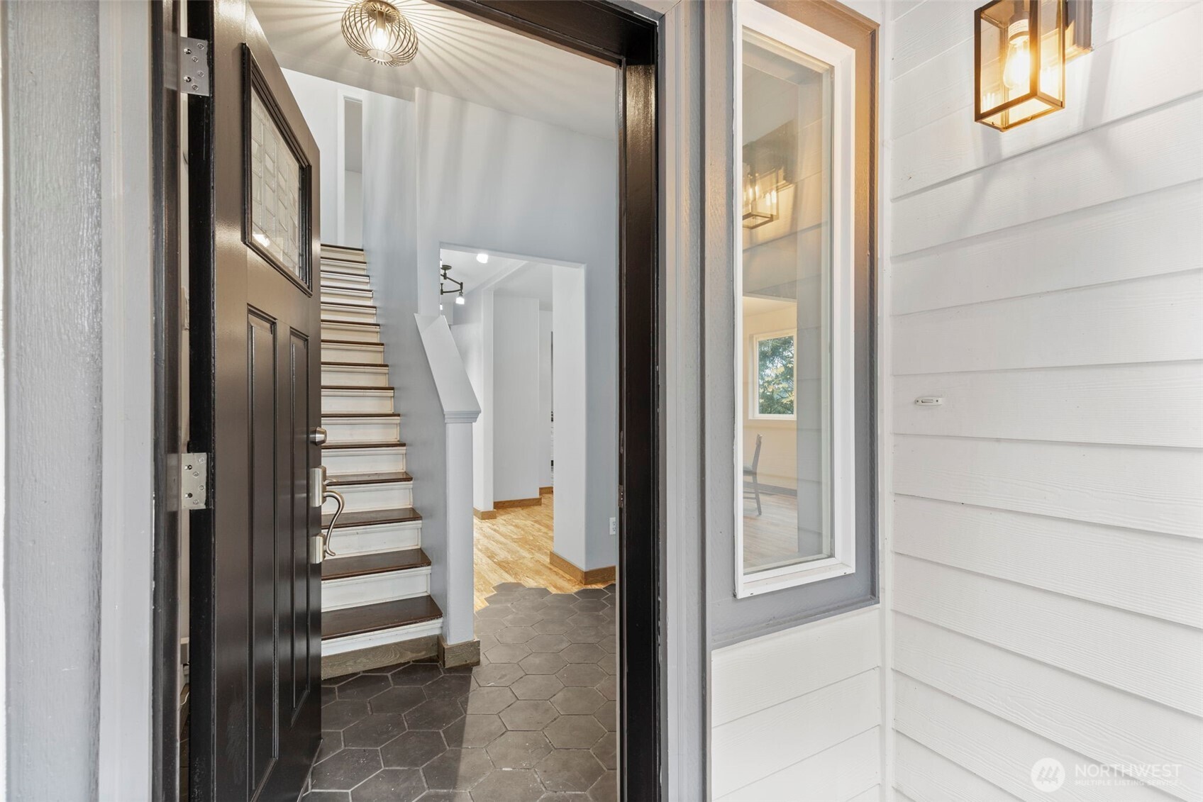 7506 353rd Street South Roy, WA 98580 - Photo 8 of 38 a view of a hallway with wooden floor and entryway