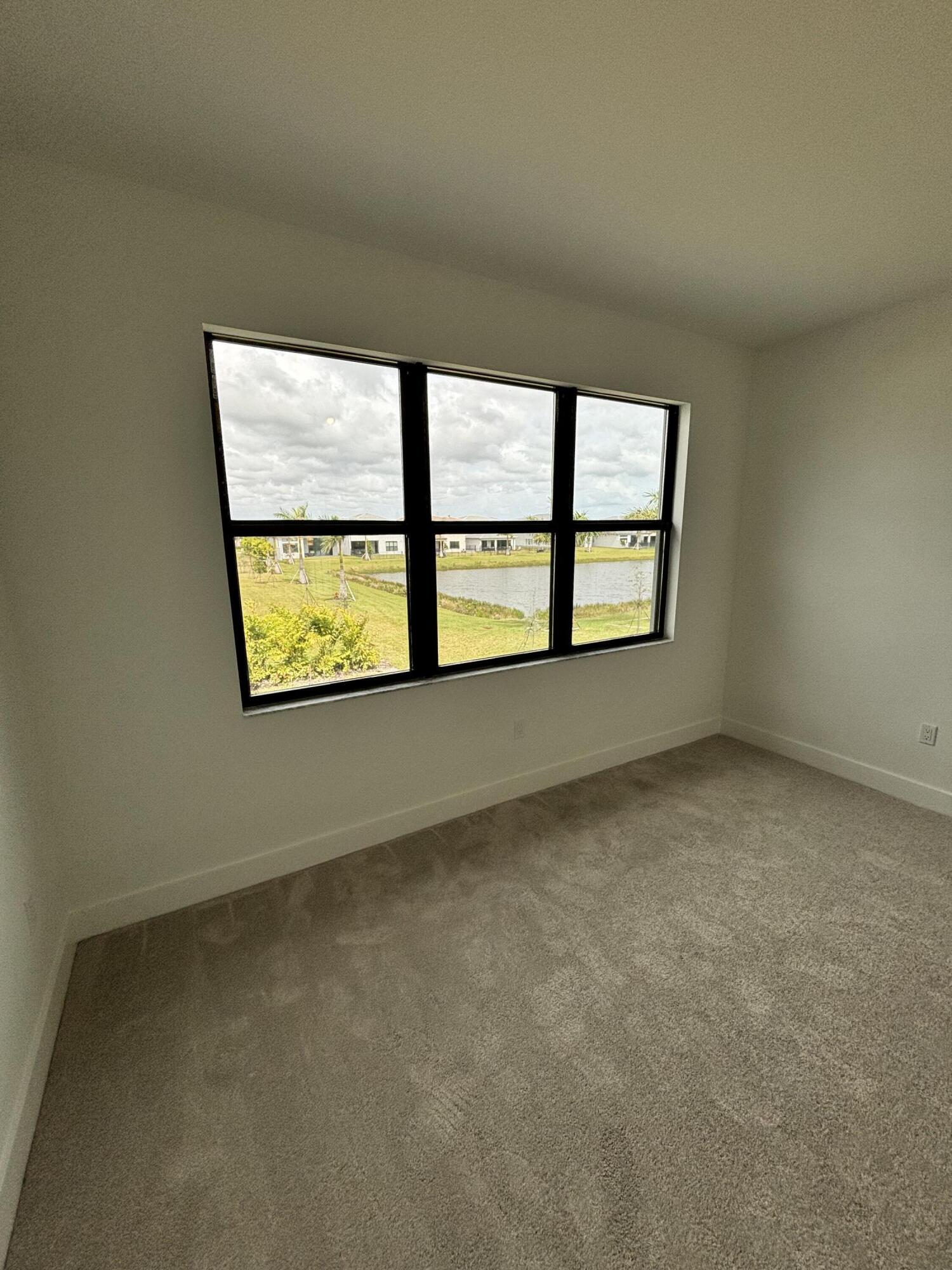 8617 Swinley Frst Way Boca Raton, FL 33434 - Photo 14 of 24 a view of an empty room with a window