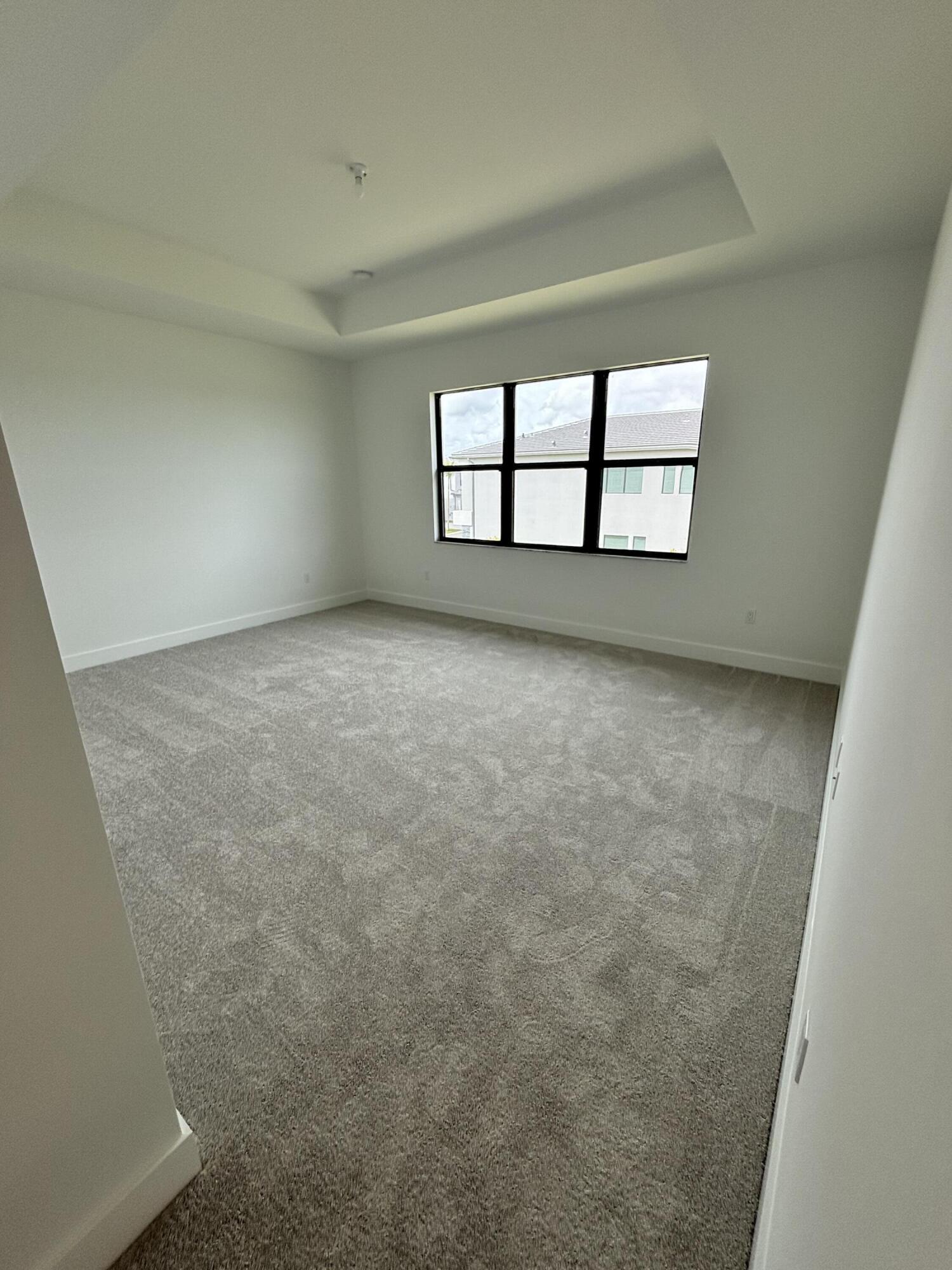 8617 Swinley Frst Way Boca Raton, FL 33434 - Photo 16 of 24 an empty room with windows
