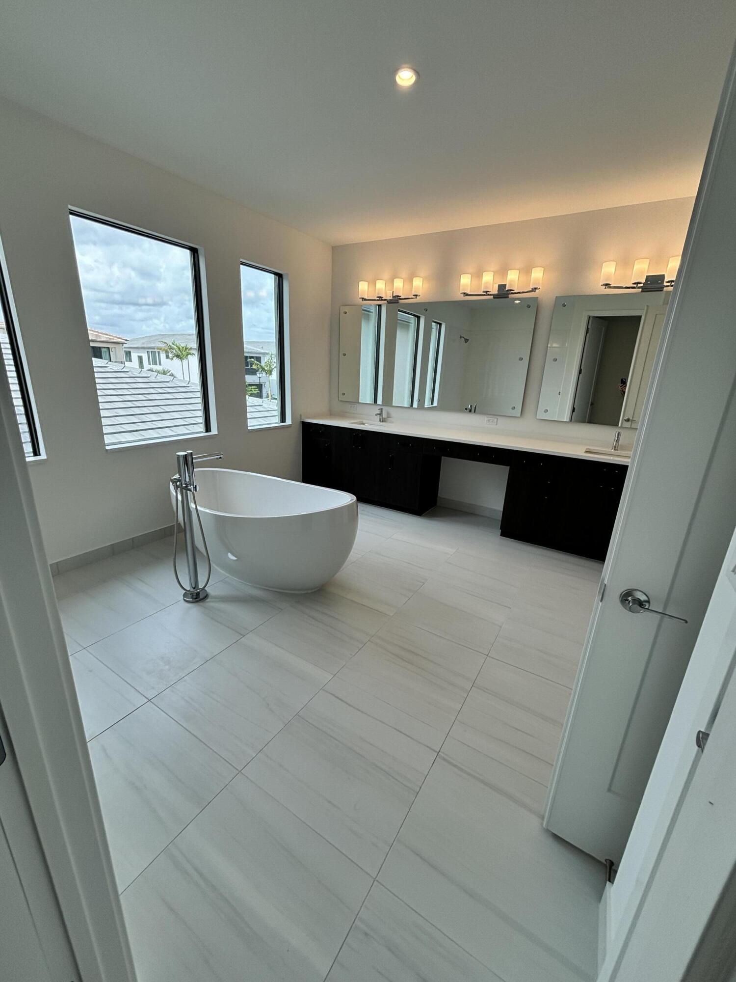 8617 Swinley Frst Way Boca Raton, FL 33434 - Photo 19 of 24 a view of an empty room with windows