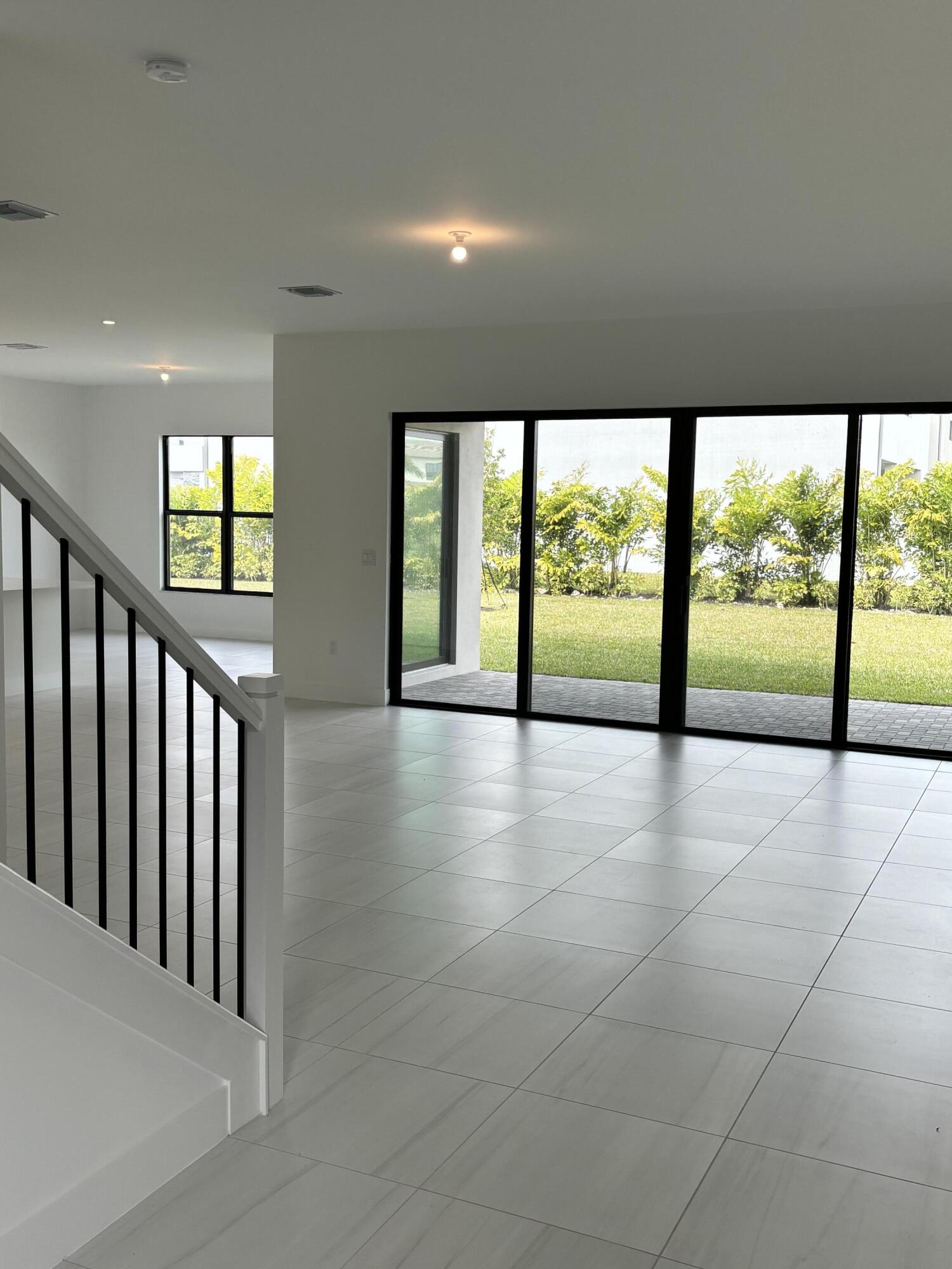 8617 Swinley Frst Way Boca Raton, FL 33434 - Photo 2 of 24 a view of an entryway with wooden floor