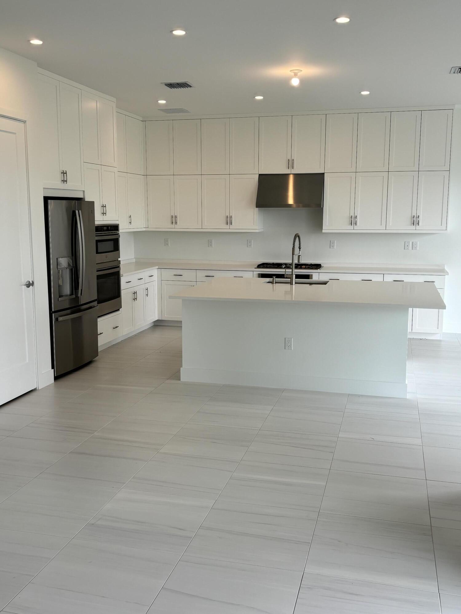 8617 Swinley Frst Way Boca Raton, FL 33434 - Photo 5 of 24 a large kitchen with cabinets