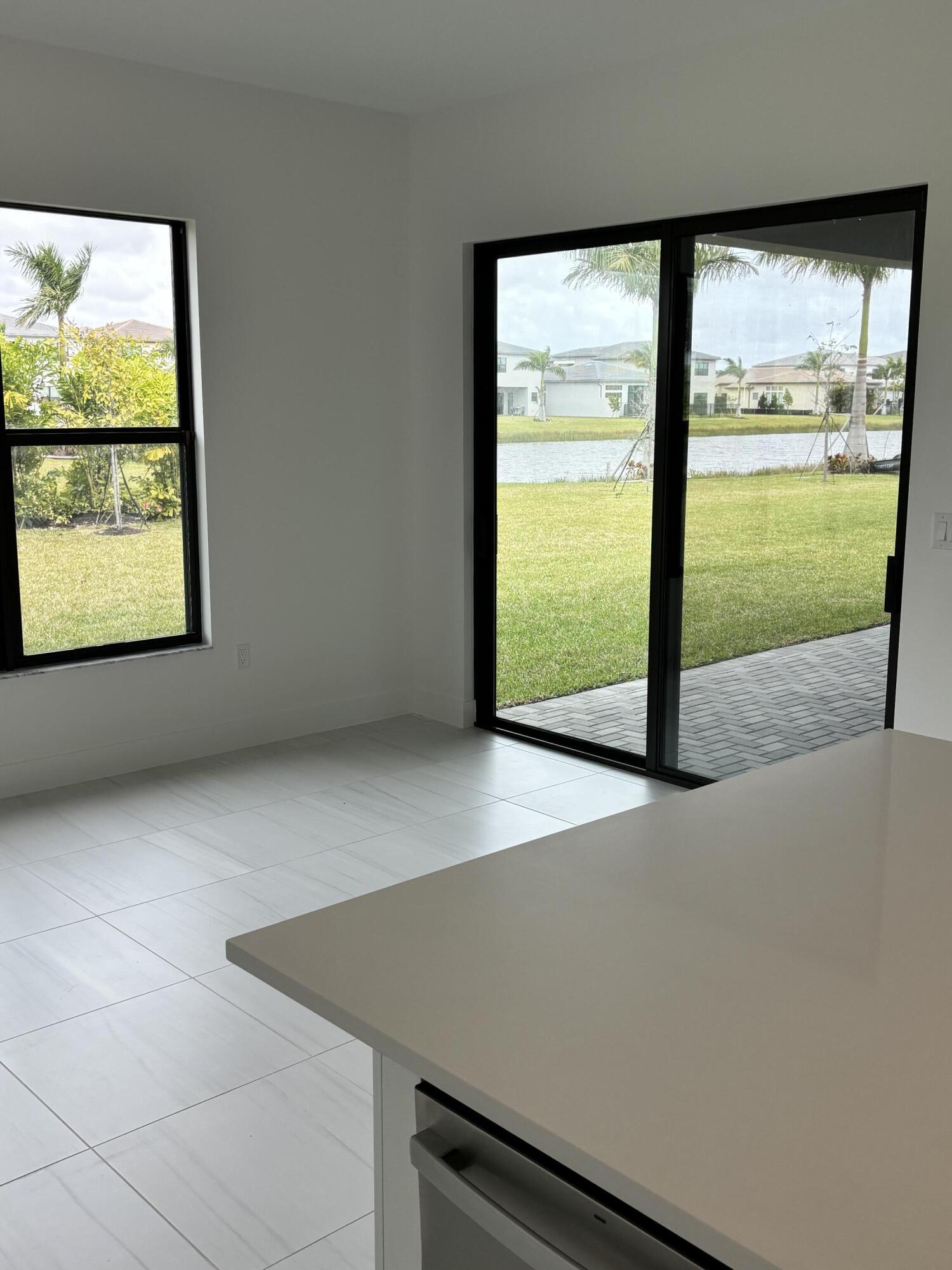 8617 Swinley Frst Way Boca Raton, FL 33434 - Photo 6 of 24 an empty room with a window