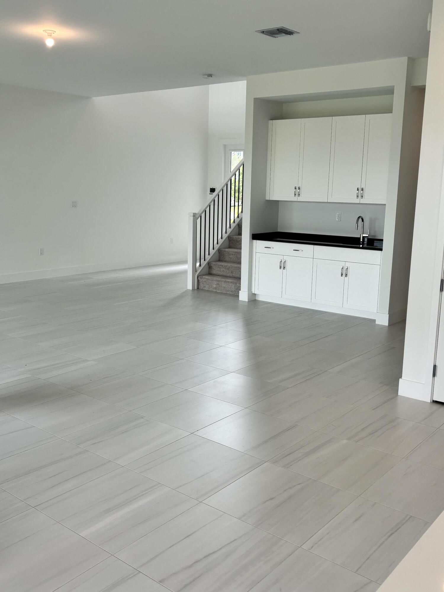 8617 Swinley Frst Way Boca Raton, FL 33434 - Photo 7 of 24 en empty room with wooden floor