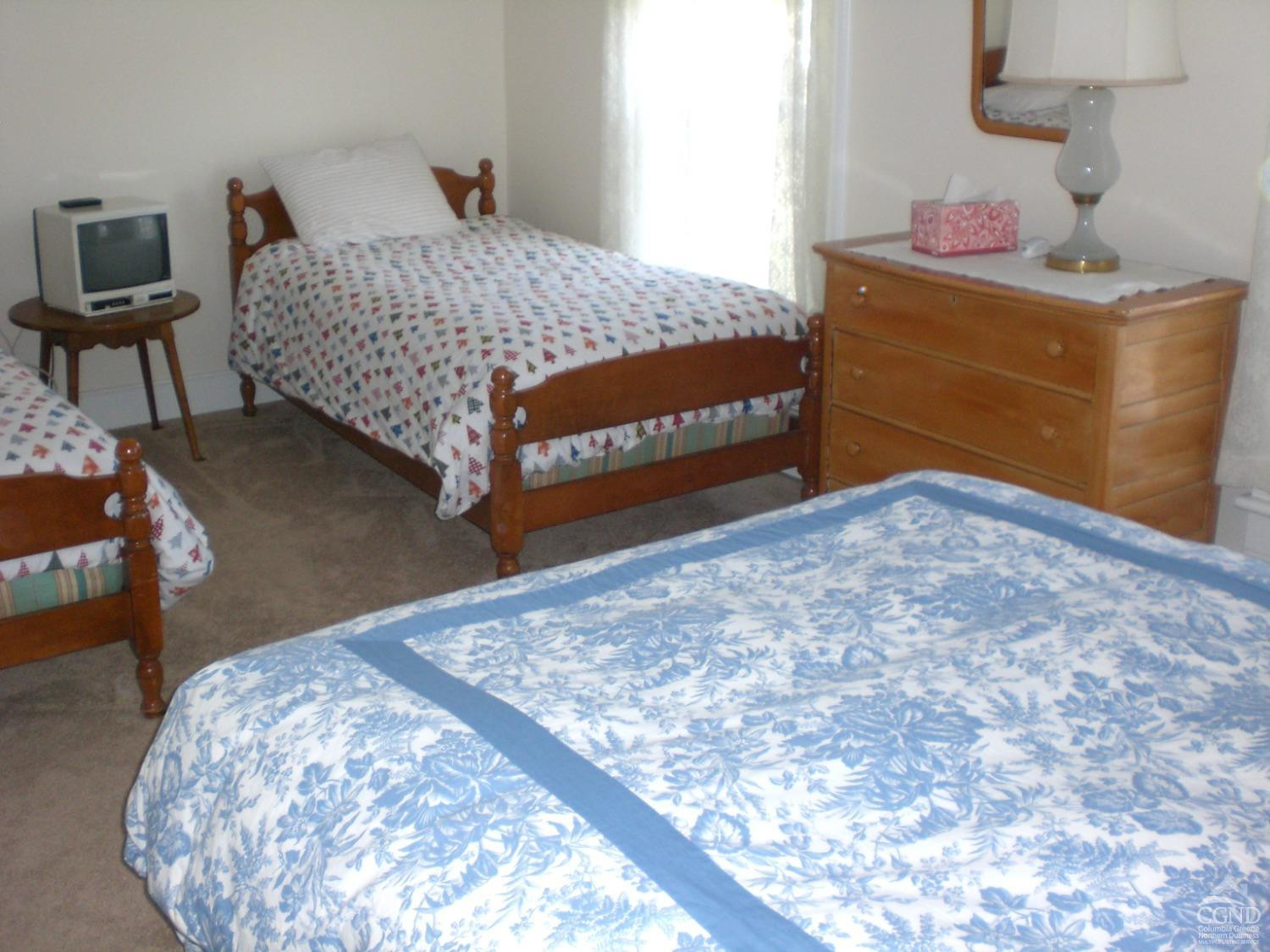 5474 Highway 23 Windham, NY 12496 - Photo 13 of 27 a bedroom with a bed and a dresser in it
