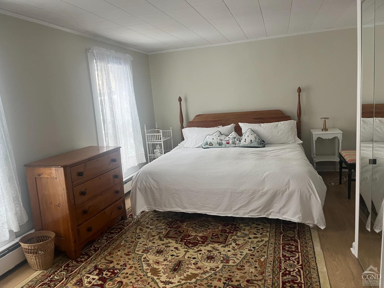 5474 Highway 23 Windham, NY 12496 - Photo 14 of 27 a bed sitting in a bedroom next to a window