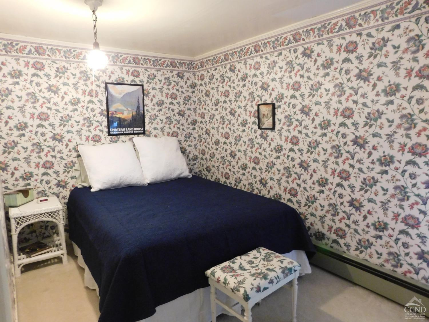 5474 Highway 23 Windham, NY 12496 - Photo 16 of 27 a bedroom with a bed and a wall painting