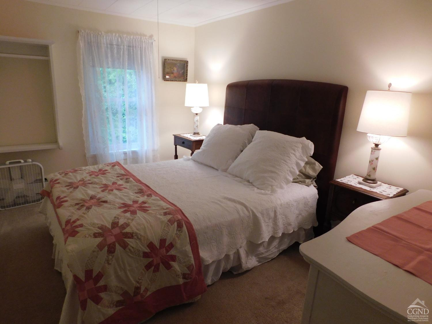 5474 Highway 23 Windham, NY 12496 - Photo 17 of 27 a bedroom with two beds and a lamp