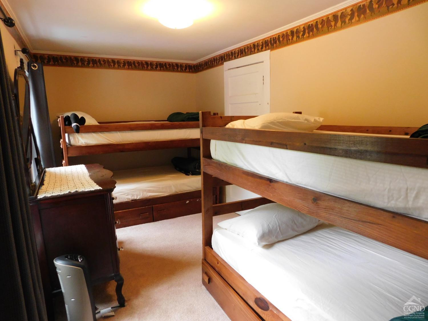 5474 Highway 23 Windham, NY 12496 - Photo 18 of 27 a bedroom with a bed and a ceiling fan