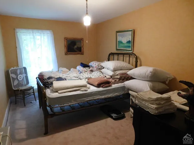 a bed room with a bed and a window