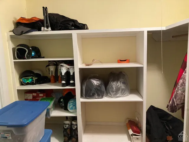 a view of living room with furniture and wooden floor