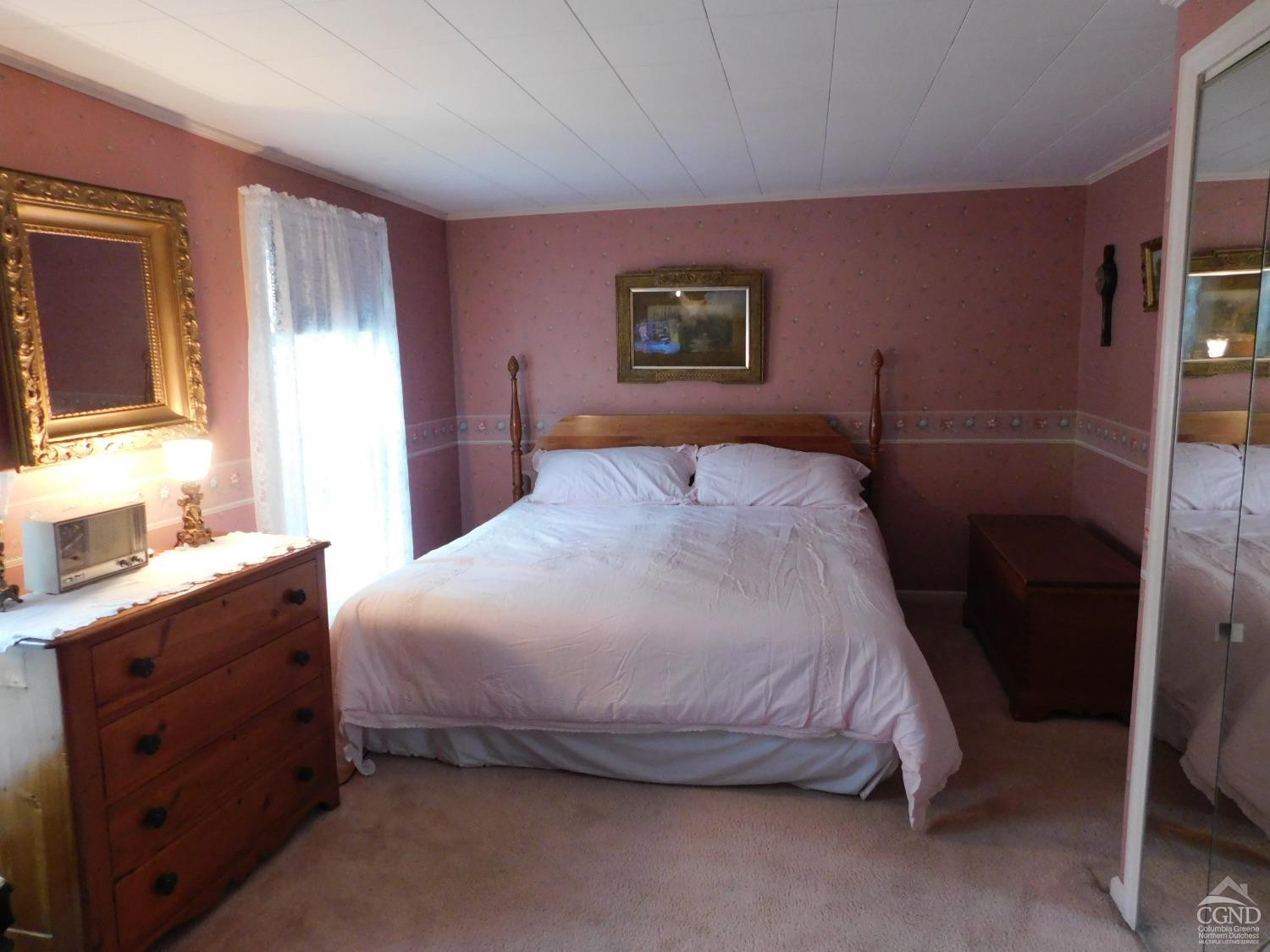 5474 Highway 23 Windham, NY 12496 - Photo 27 of 27 a bedroom with a bed and a dresser