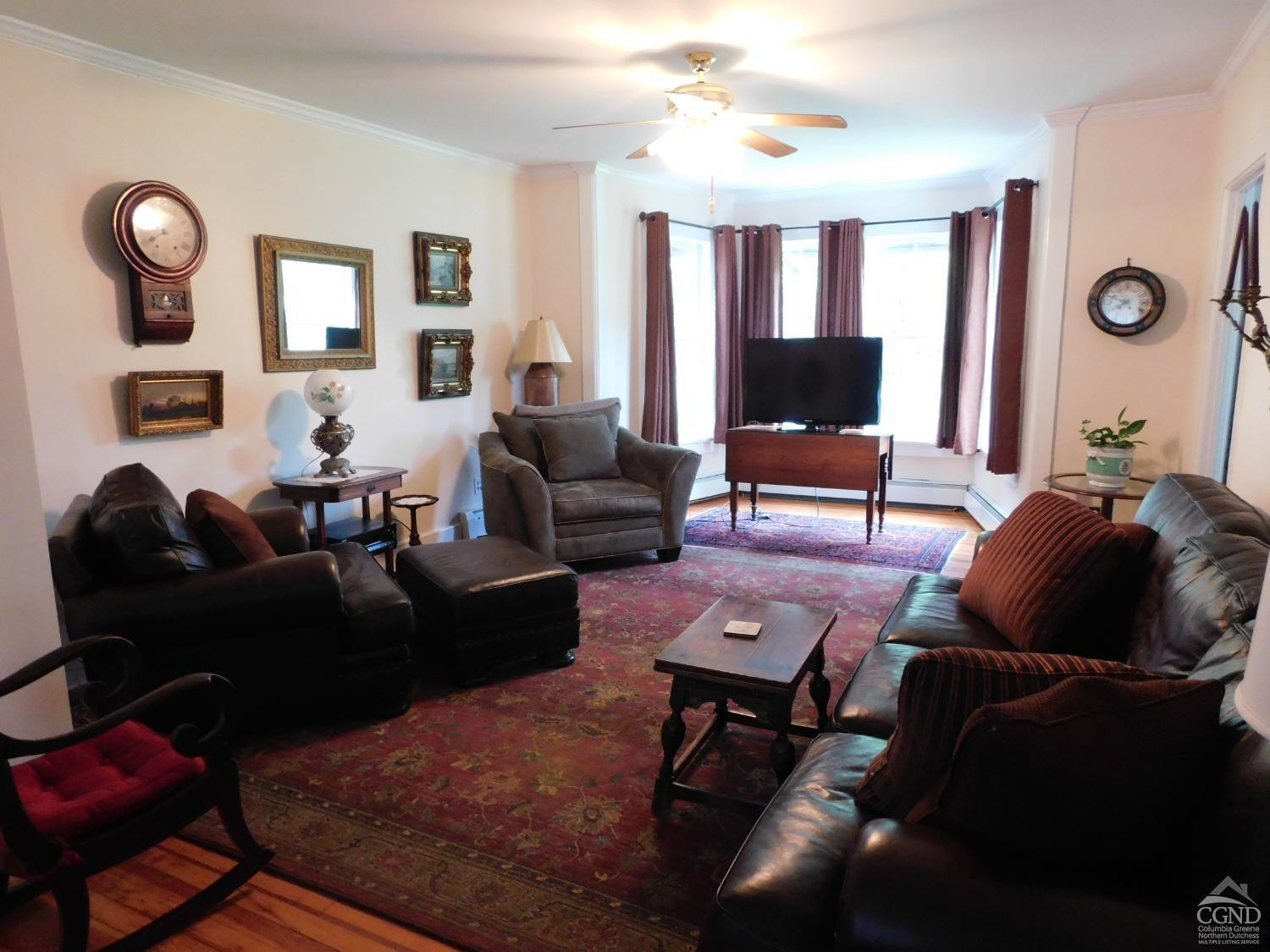 5474 Highway 23 Windham, NY 12496 - Photo 6 of 27 a living room with furniture and a flat screen tv