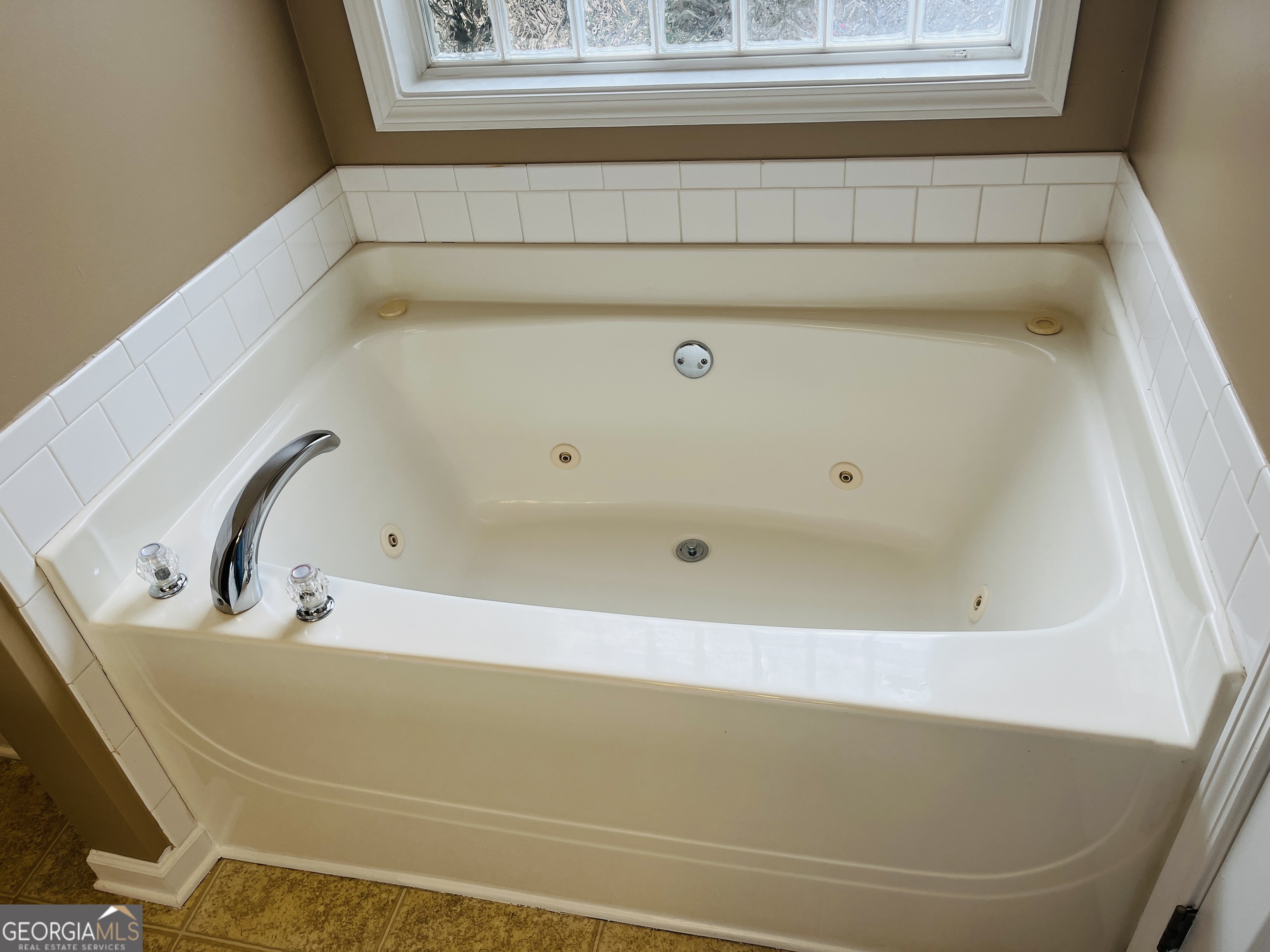 62 Green Spring Newnan, GA 30265 - Photo 18 of 31 a bathroom with a tub