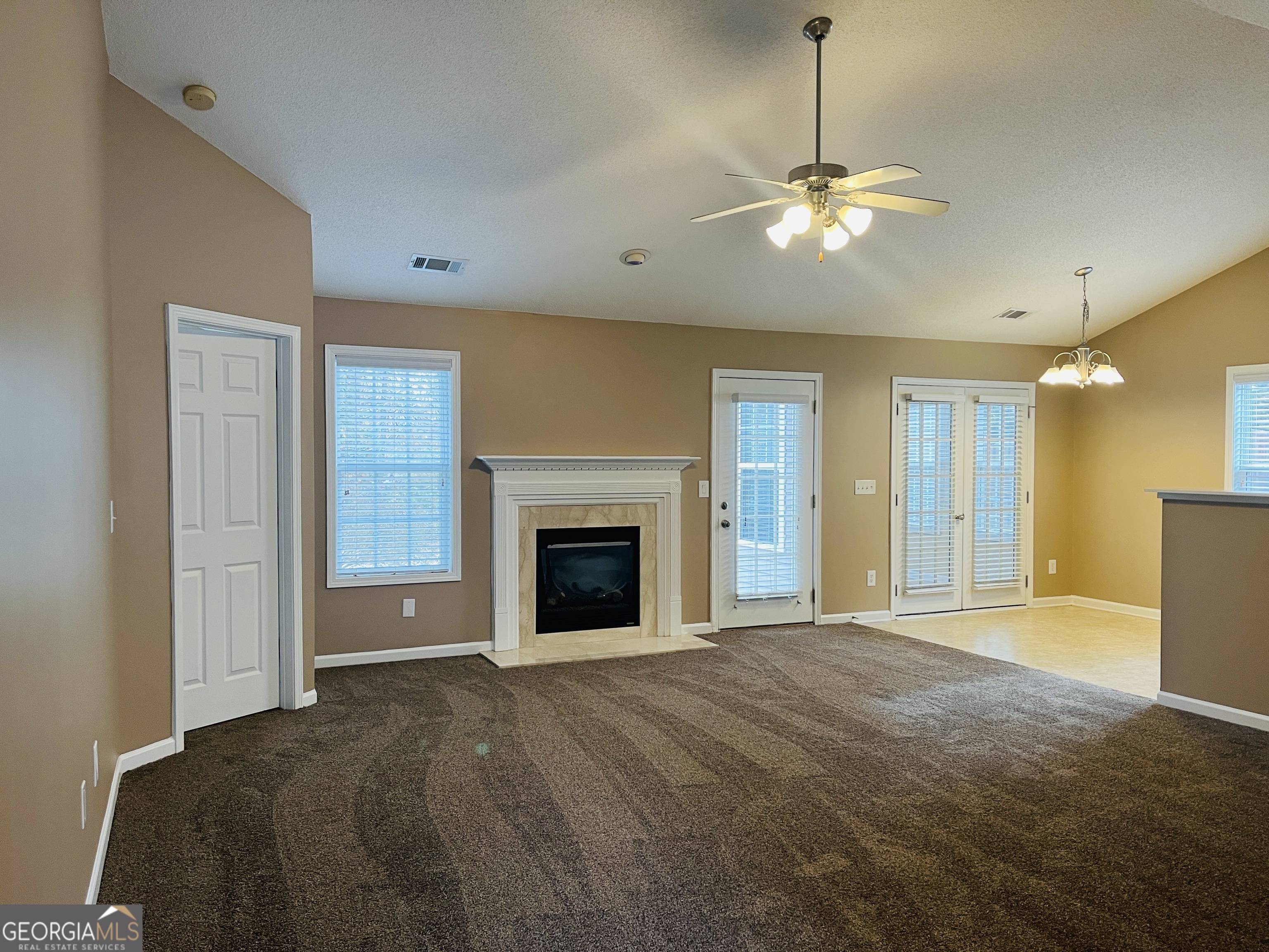 62 Green Spring Newnan, GA 30265 - Photo 2 of 31 a view of an empty room with a fireplace and a window
