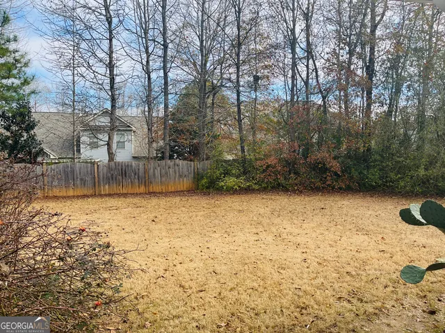 a backyard of a house with lots of green space