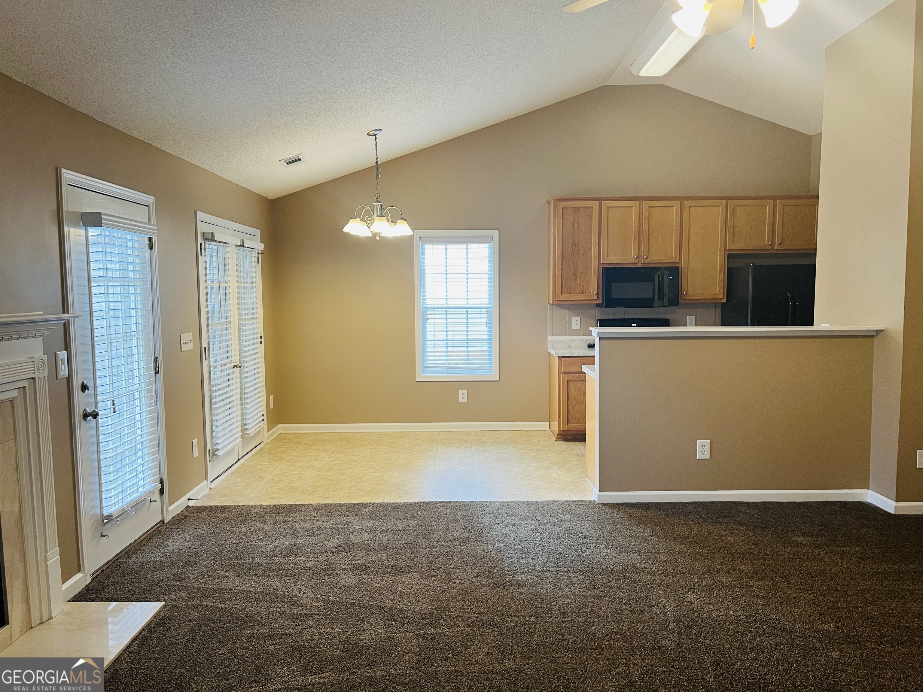 62 Green Spring Newnan, GA 30265 - Photo 3 of 31 a view of a kitchen with a sink and dishwasher cabinet with wooden floor