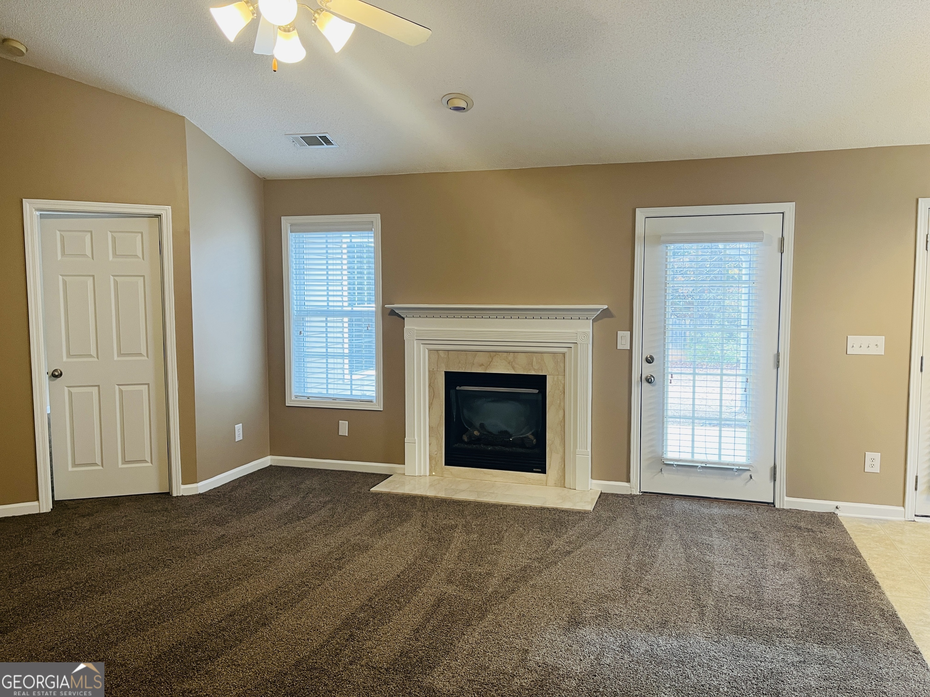 62 Green Spring Newnan, GA 30265 - Photo 5 of 31 a view of an empty room with a fireplace