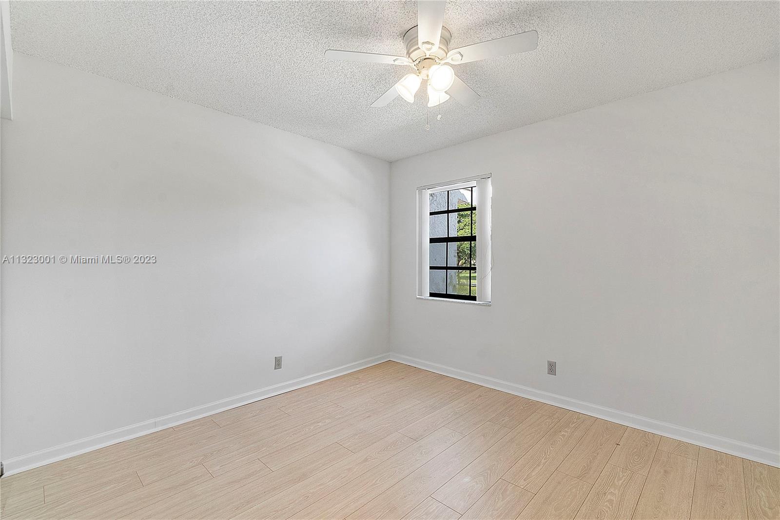 3000 Norwood Place, Unit N202 Boca Raton, FL 33431 - Photo 16 of 26 an empty room with a window