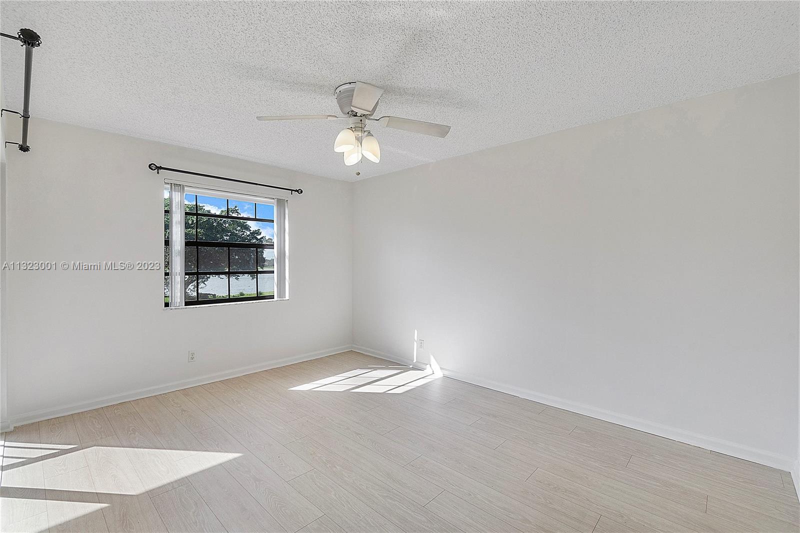 3000 Norwood Place, Unit N202 Boca Raton, FL 33431 - Photo 19 of 26 an empty room with a window