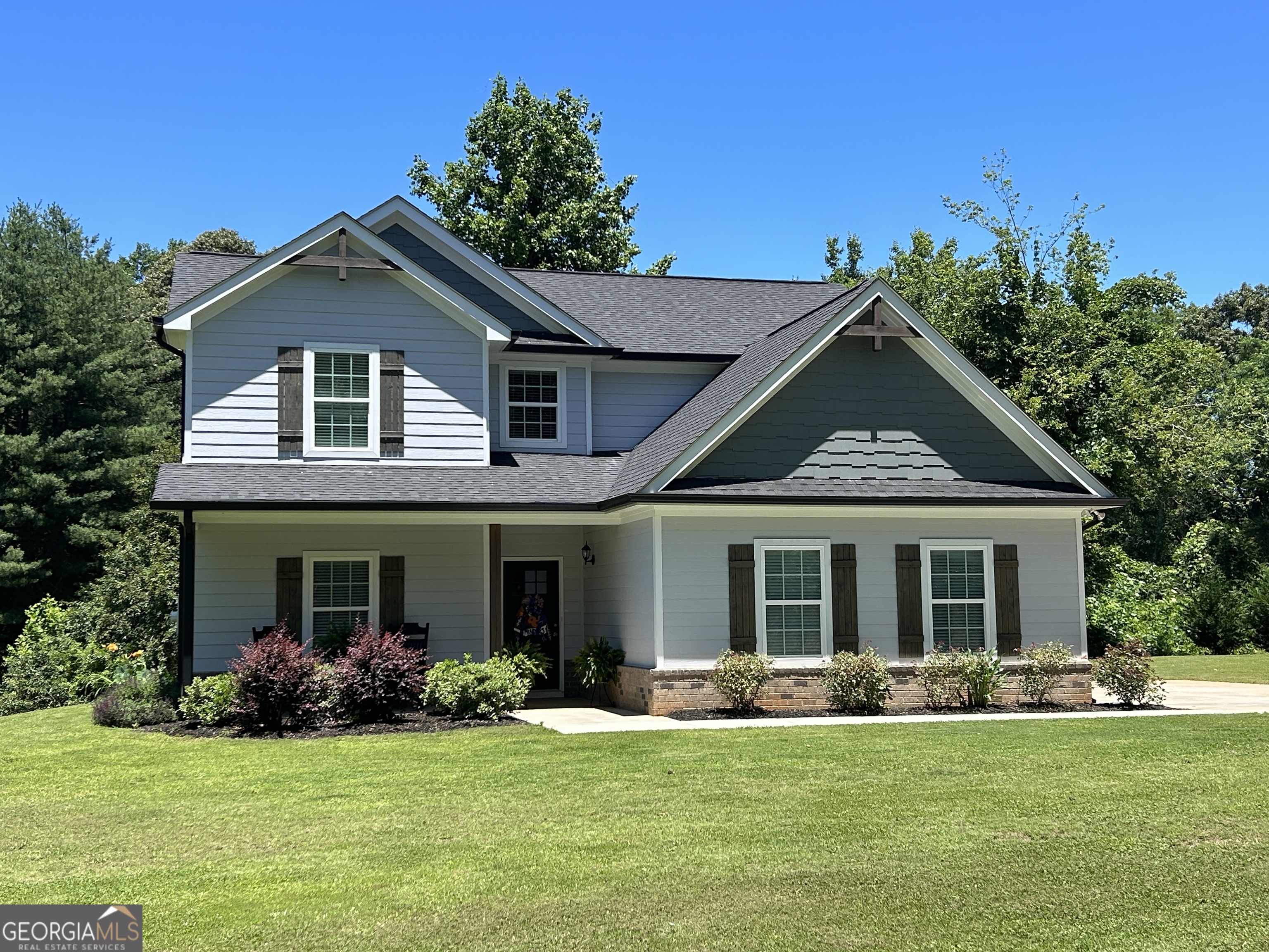 2259 Pea Ridge Road Cornelia, GA 30531 - Photo 1 of 1 front view of a house with a yard