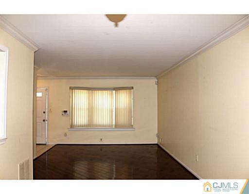 2204 Timber Oaks Road Edison, NJ 08820 - Photo 3 of 13 a view of an empty room and window