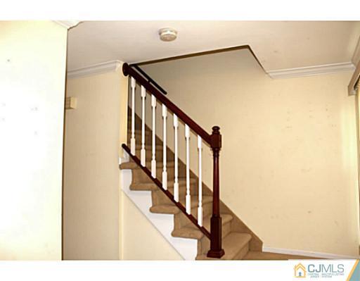 2204 Timber Oaks Road Edison, NJ 08820 - Photo 5 of 13 a view of staircase with railing and a painting
