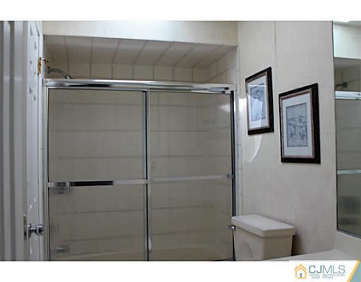 2204 Timber Oaks Road Edison, NJ 08820 - Photo 8 of 13 a bathroom with a shower