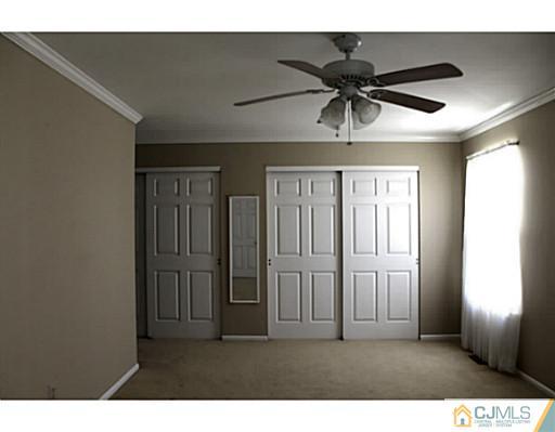 2204 Timber Oaks Road Edison, NJ 08820 - Photo 9 of 13 a view of a livingroom with a ceiling fan