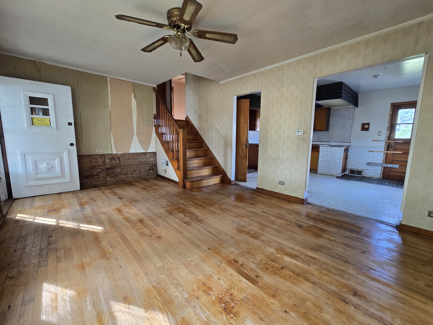 7742 South Oketo Avenue Bridgeview, IL 60455 - Photo 12 of 14 a view of a livingroom with wooden floor and ceiling fan