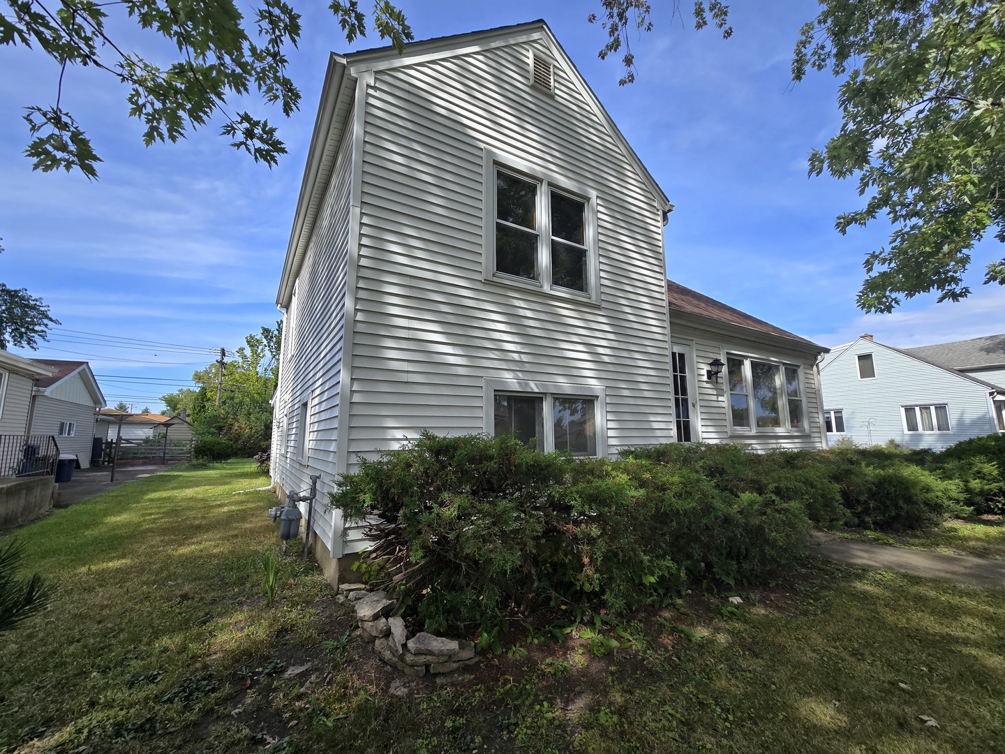 7742 South Oketo Avenue Bridgeview, IL 60455 - Photo 4 of 14 a front view of a house with a yard