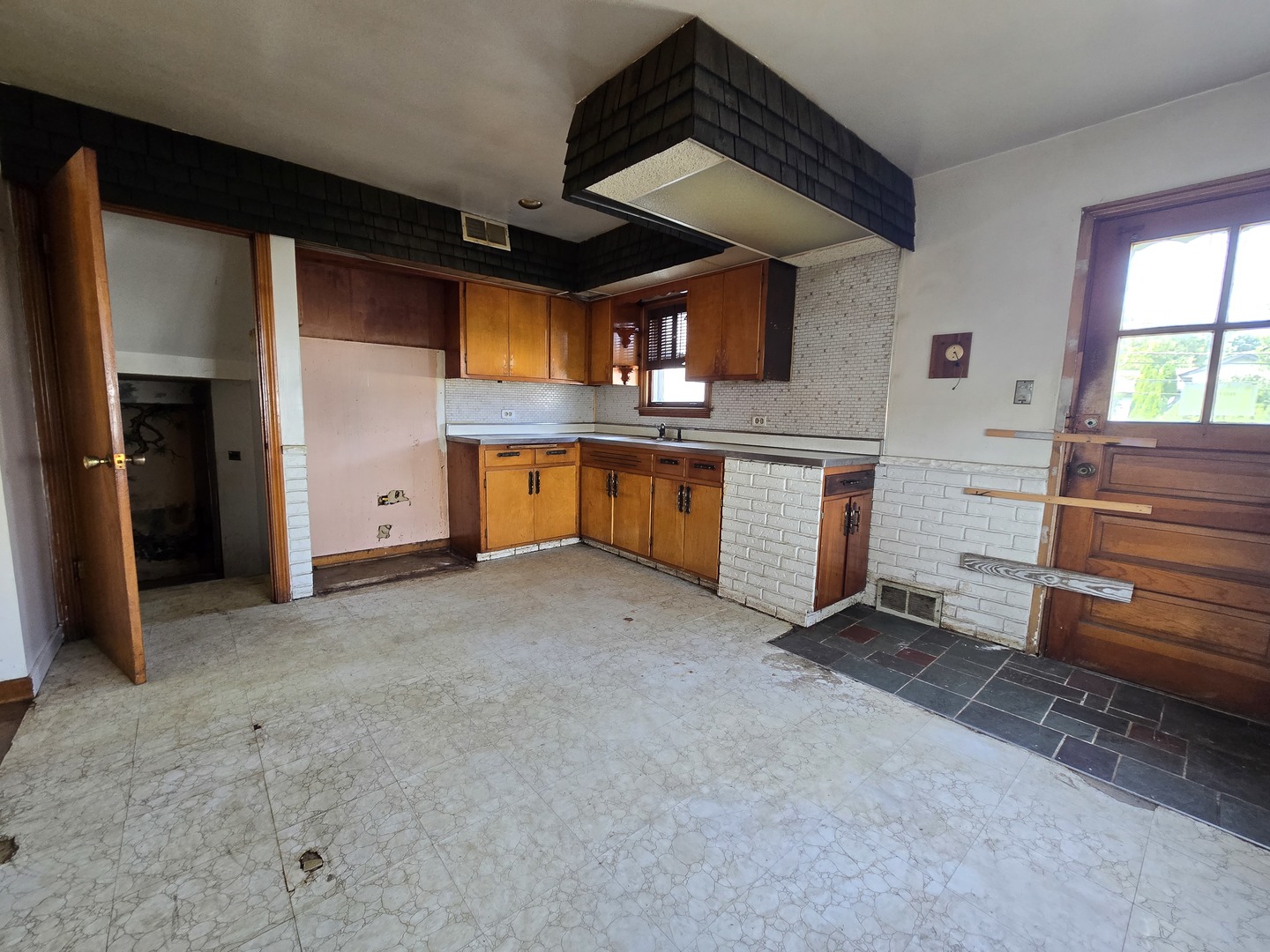 7742 South Oketo Avenue Bridgeview, IL 60455 - Photo 9 of 14 a view of a kitchen with a sink and dishwasher cabinets