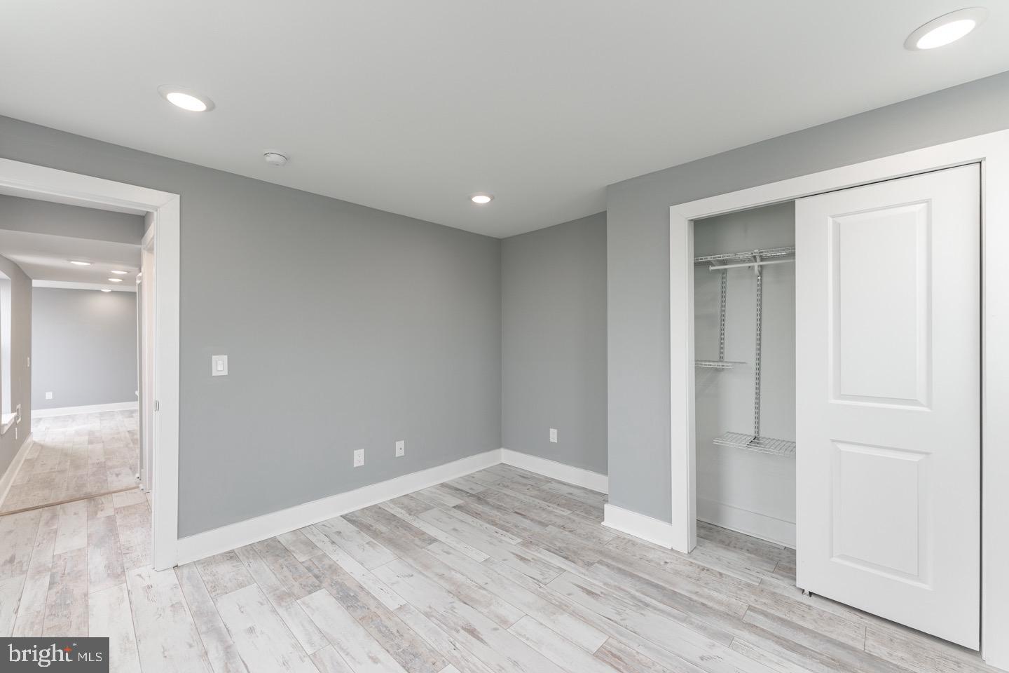 3252 Miller Street, Unit 2 Philadelphia, PA 19134 - Photo 14 of 16 wooden floor in an empty room with a window