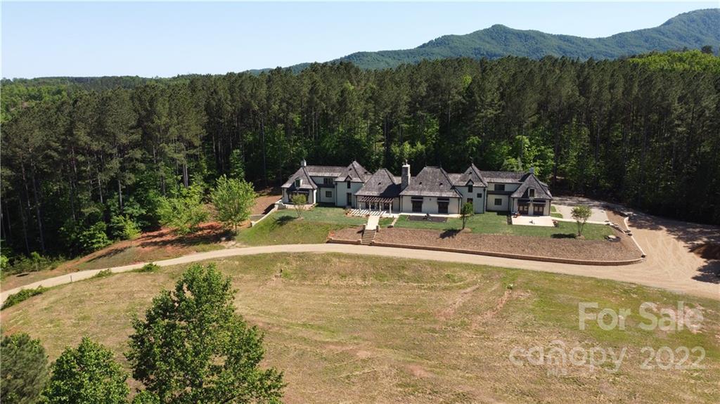 20 Hawk Ridge Drive Mill Spring, NC 28756 - Photo 1 of 48 a view of a swimming pool with a yard and mountain view