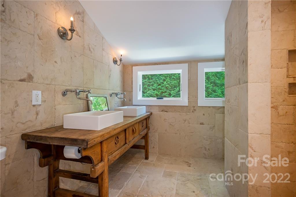 20 Hawk Ridge Drive Mill Spring, NC 28756 - Photo 21 of 48 a bathroom with a sink a bath tub and a shower