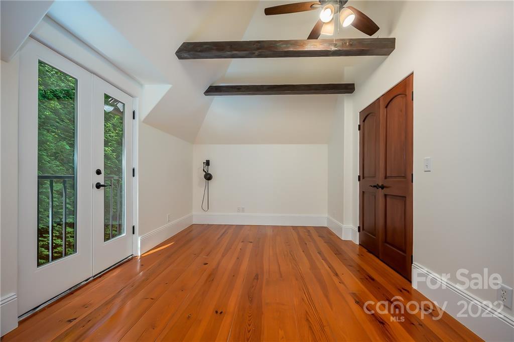 20 Hawk Ridge Drive Mill Spring, NC 28756 - Photo 27 of 48 a view of empty room with wooden floor and fan