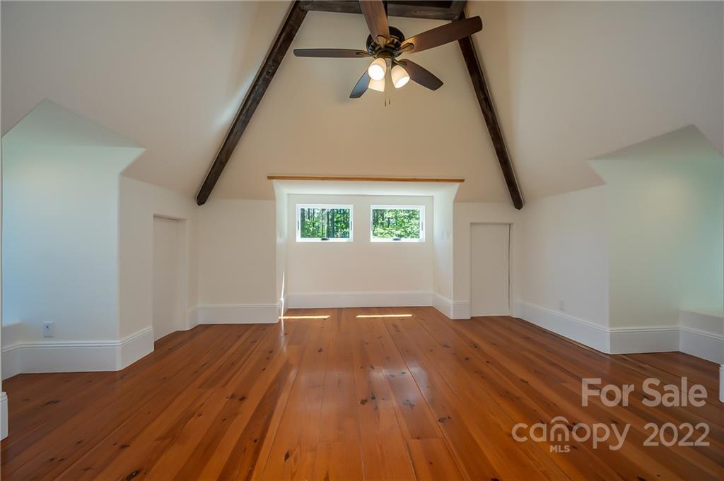 20 Hawk Ridge Drive Mill Spring, NC 28756 - Photo 34 of 48 a view of empty room with wooden floor and fan