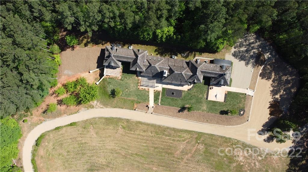 20 Hawk Ridge Drive Mill Spring, NC 28756 - Photo 7 of 48 an aerial view of a house with a yard and trees