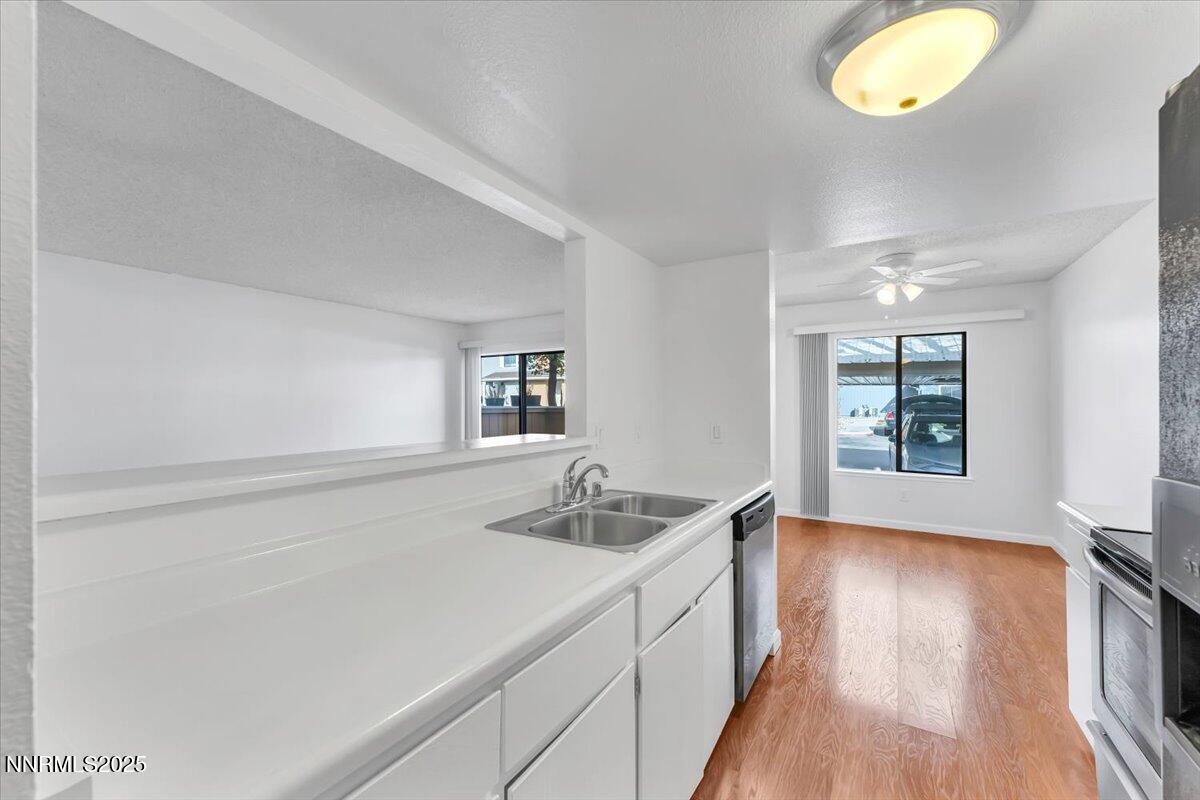 3230 Wedekind Road, Unit 64 Sparks, NV 89431 - Photo 14 of 28 a hallway with sink and window
