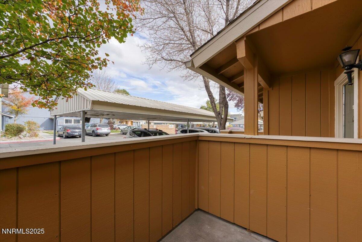 3230 Wedekind Road, Unit 64 Sparks, NV 89431 - Photo 25 of 28 a view of a balcony with wooden floor and fence